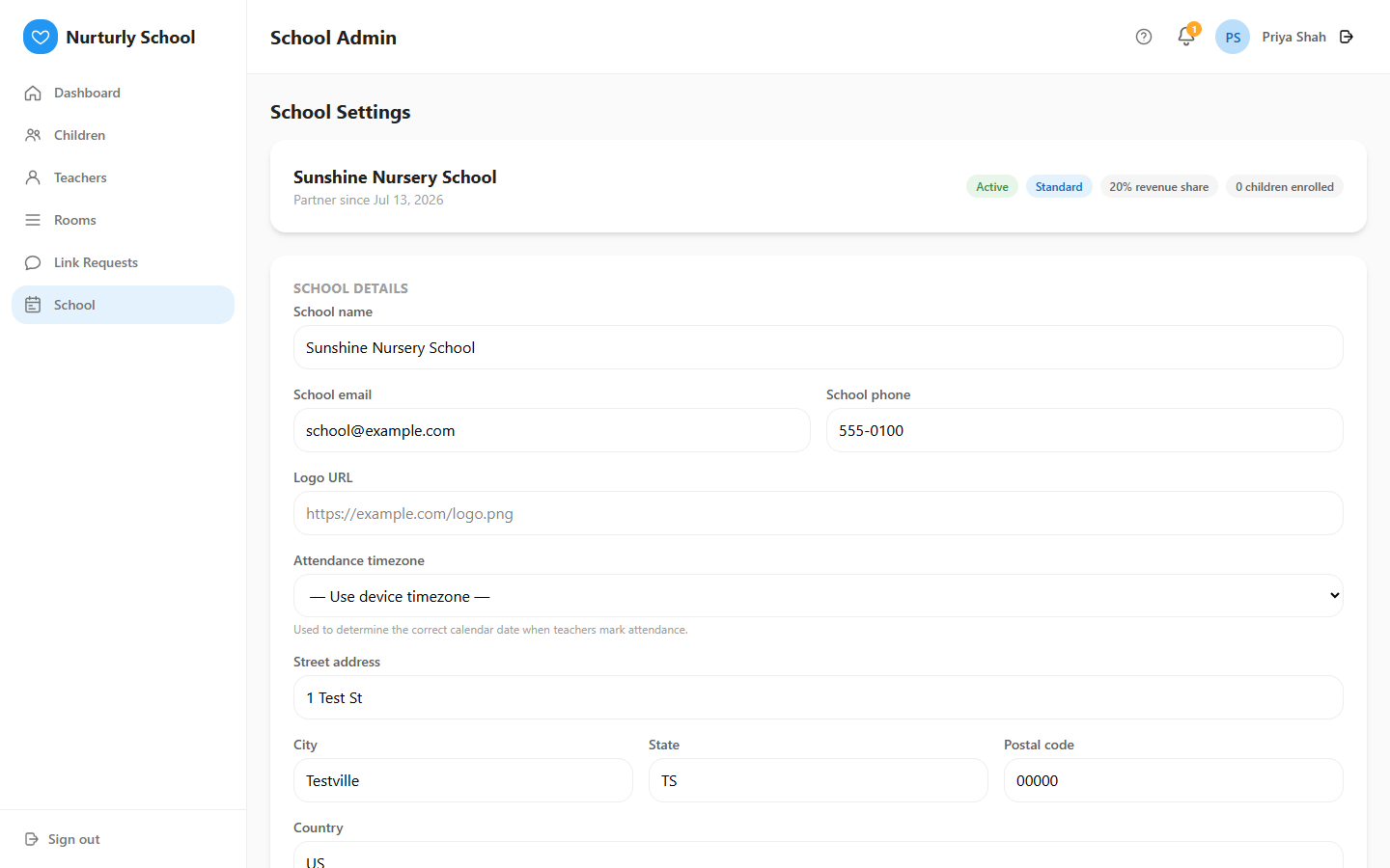 The School Settings page with a summary card and an editable profile form.